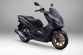 Black Yamaha NMAX scooter side view